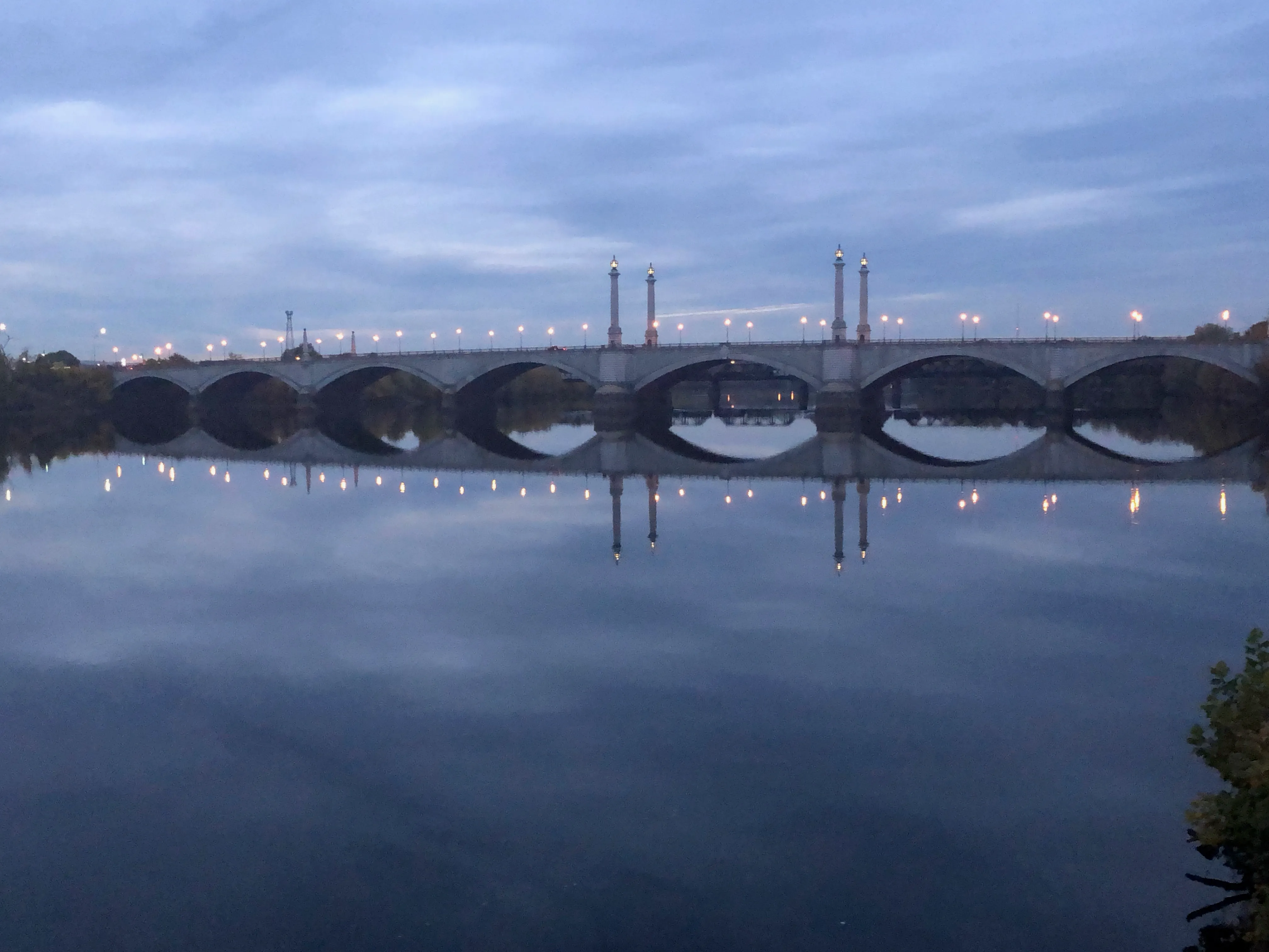 The church and bridge illuminated at dusk